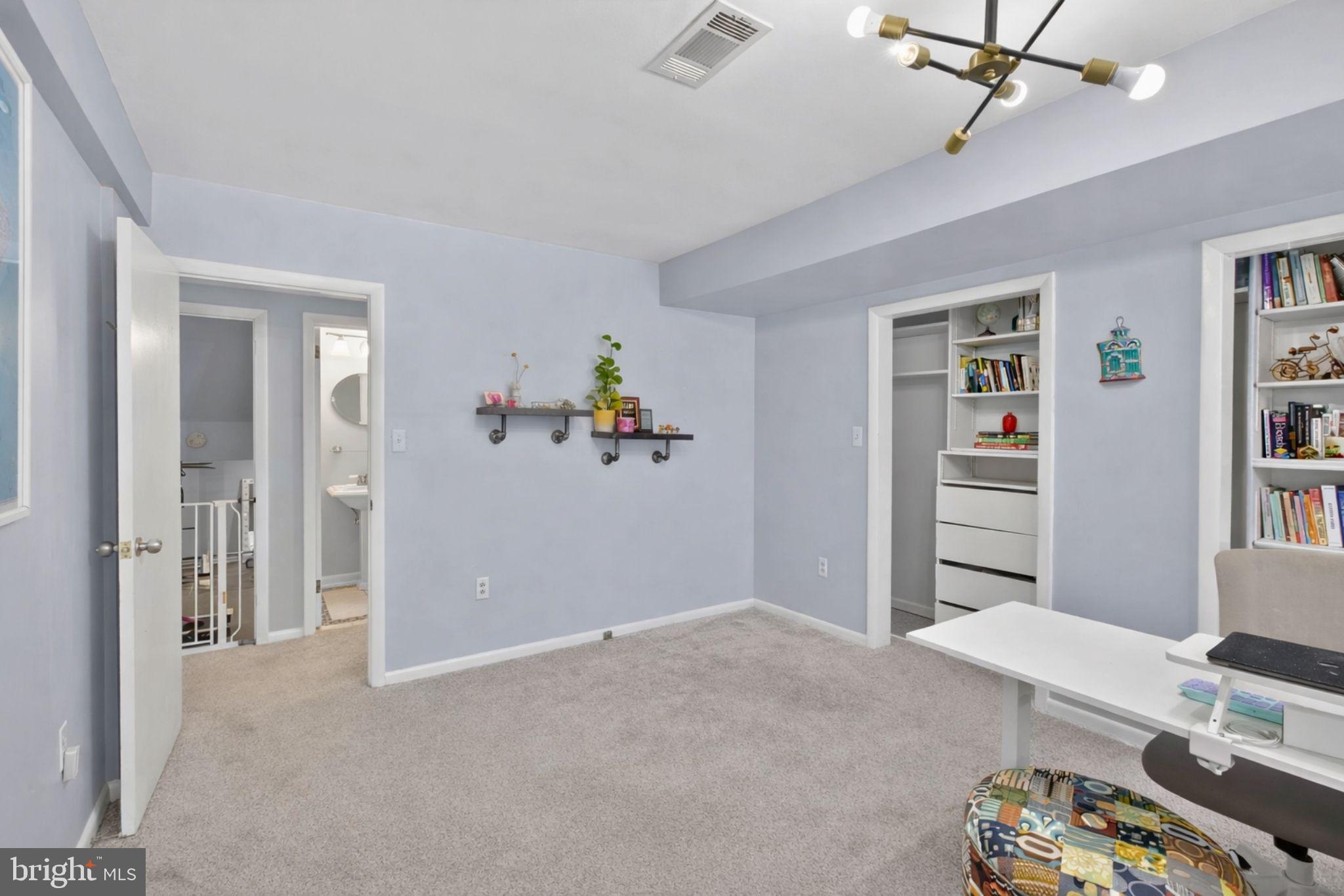 2849 Hideaway Road Fairfax, VA 22031 - Photo 17 of 45 a bedroom with a bed and a chandelier