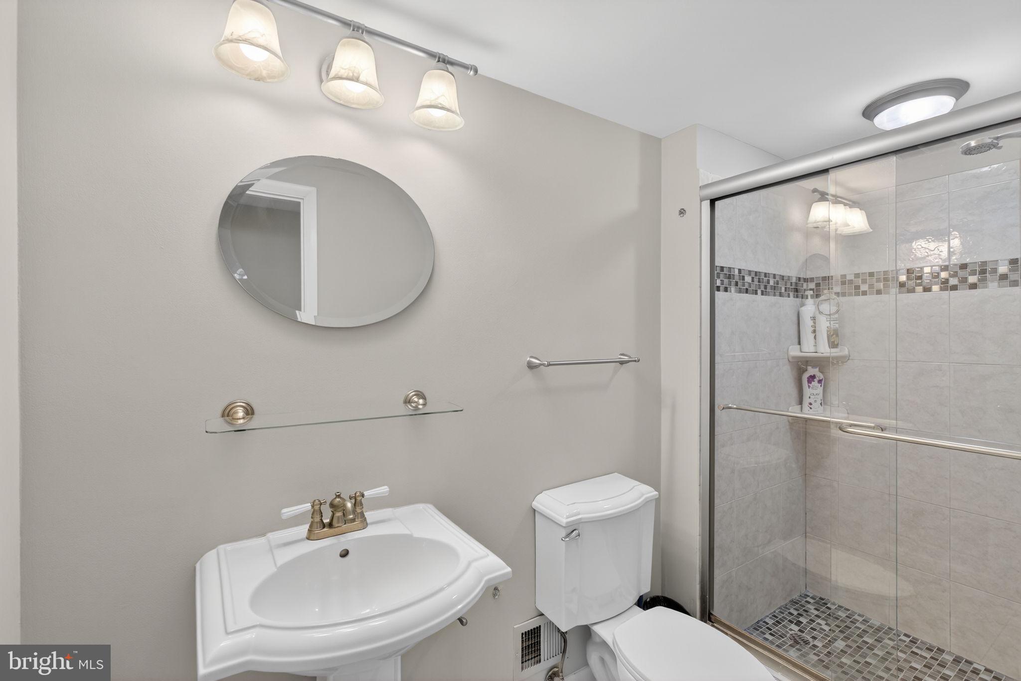 2849 Hideaway Road Fairfax, VA 22031 - Photo 18 of 45 a bathroom with a sink mirror and toilet