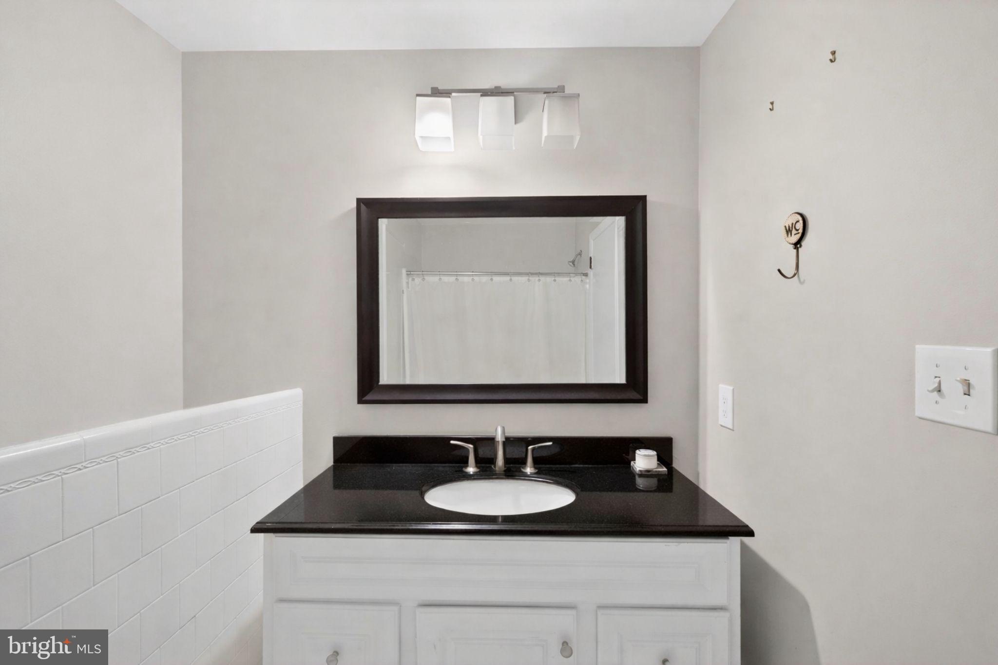 2849 Hideaway Road Fairfax, VA 22031 - Photo 21 of 45 a bathroom with a sink and a mirror