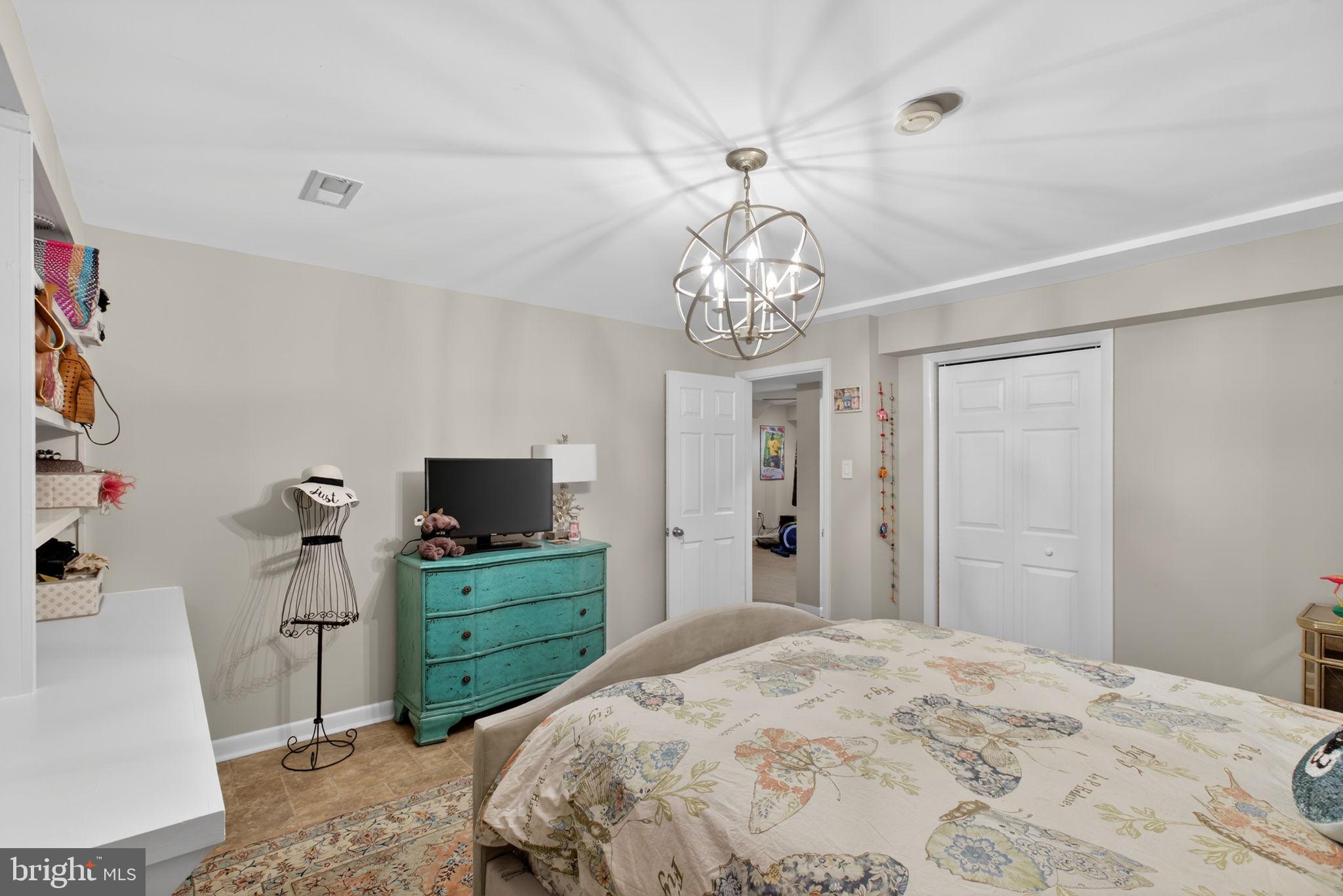 2849 Hideaway Road Fairfax, VA 22031 - Photo 26 of 45 a bedroom with a bed and a television