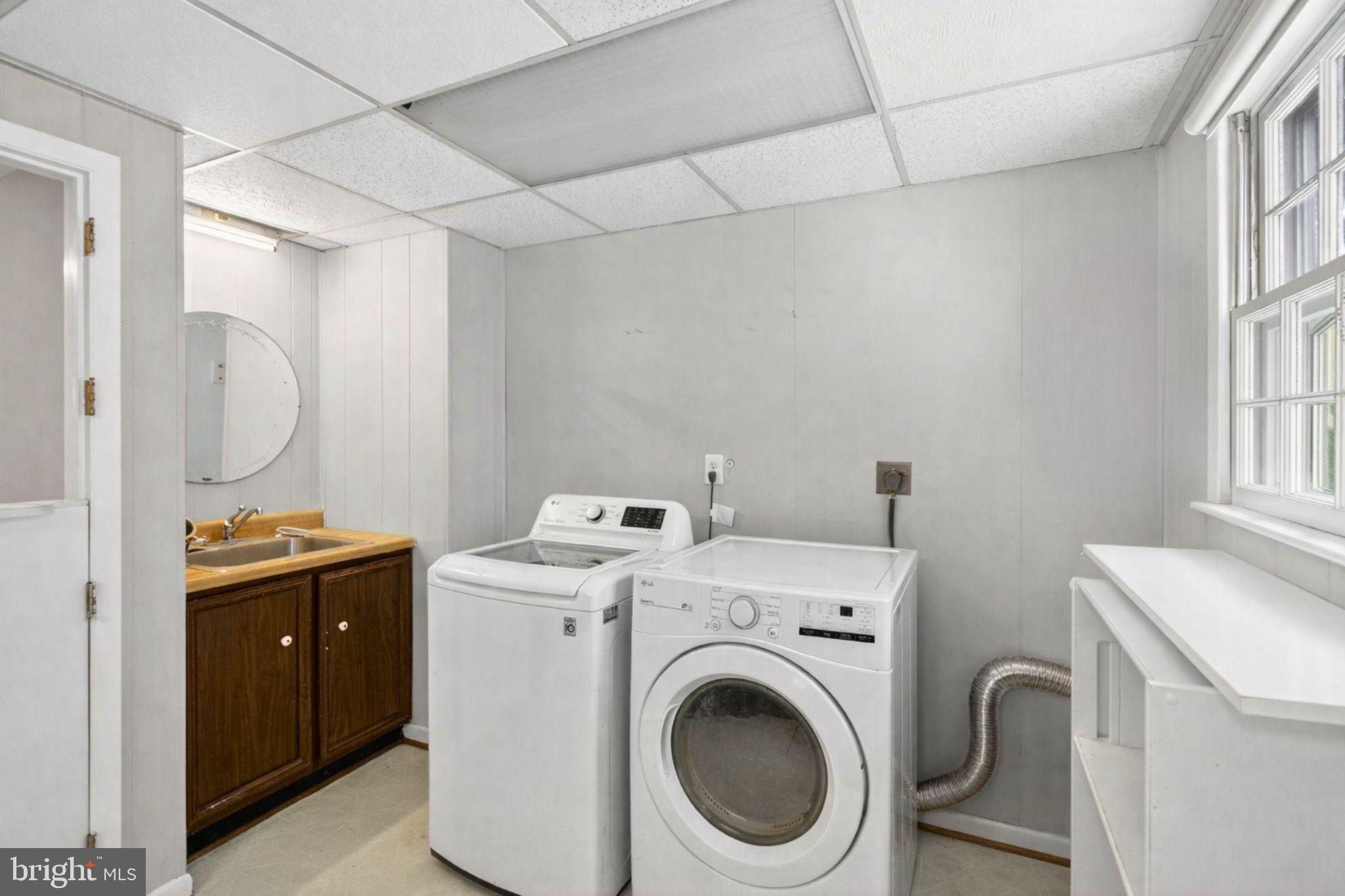2849 Hideaway Road Fairfax, VA 22031 - Photo 32 of 45 a view of storage and utility room with washer and dryer