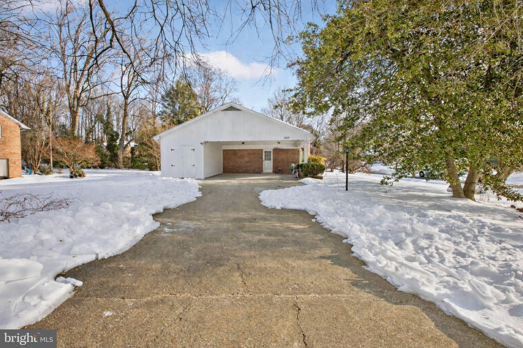 2849 Hideaway Road Fairfax, VA 22031 - Photo 33 of 45 a front view of a house with a yard and garage