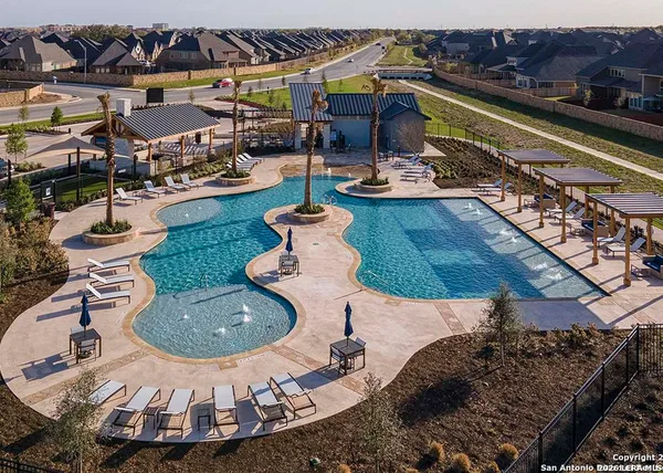 a swimming pool with outdoor seating