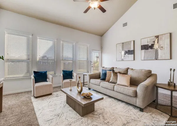 a living room with furniture and a couch