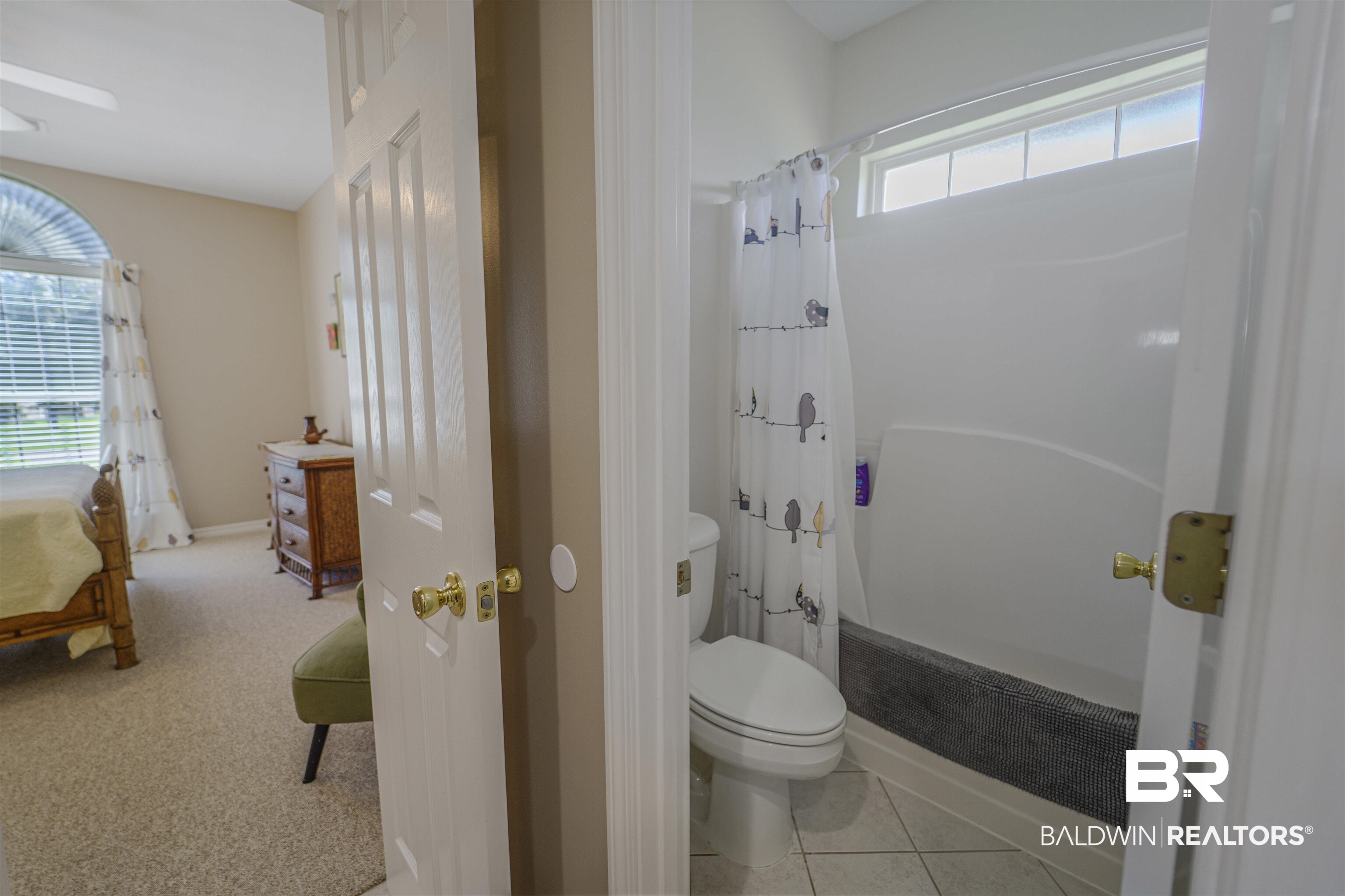 9505 Lakeview Drive Foley, AL 36535 - Photo 25 of 38 Bathroom with curtained shower and light tile patterned floors