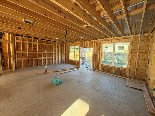 a view of empty room with floor to ceiling window