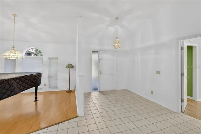 a kitchen with granite countertop a refrigerator and a sink