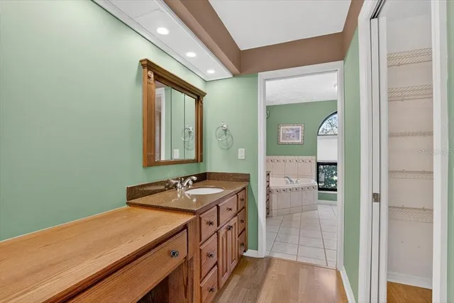 a bathroom with a sink and tub