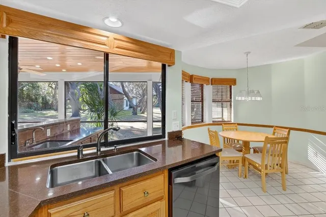 a view of a porch with chairs and iron stairs