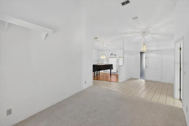 a view of a kitchen with a large window and dining table