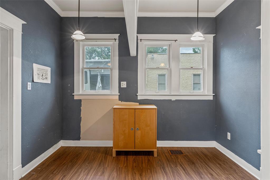 2717 Colcord Avenue Waco, TX 76707 - Photo 20 of 34 an empty room with wooden floor and windows