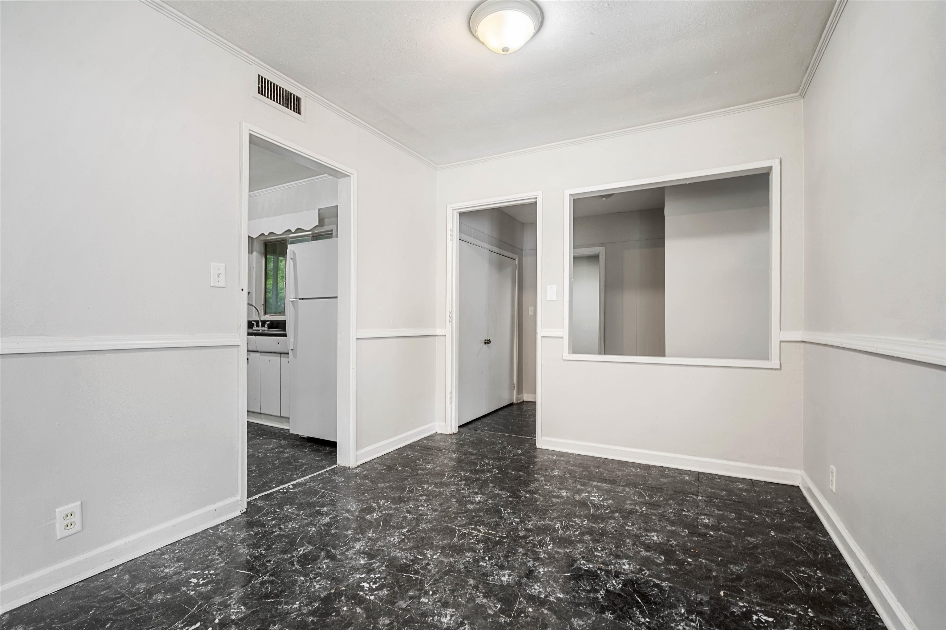 3014 Farcott Street Mobile, AL 36606 - Photo 10 of 26 Empty room featuring baseboards and crown molding