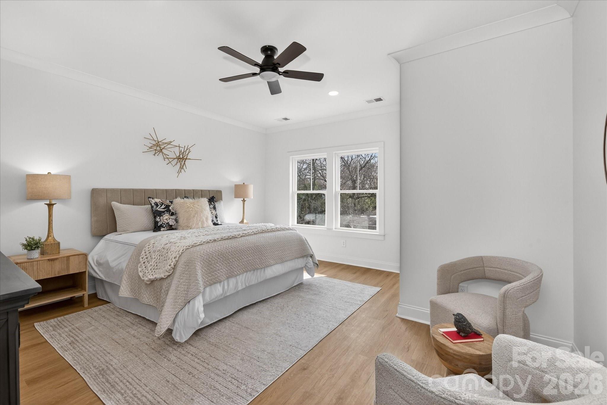 216 Lander Street Charlotte, NC 28208 - Photo 18 of 33 a bedroom with a large bed and a window