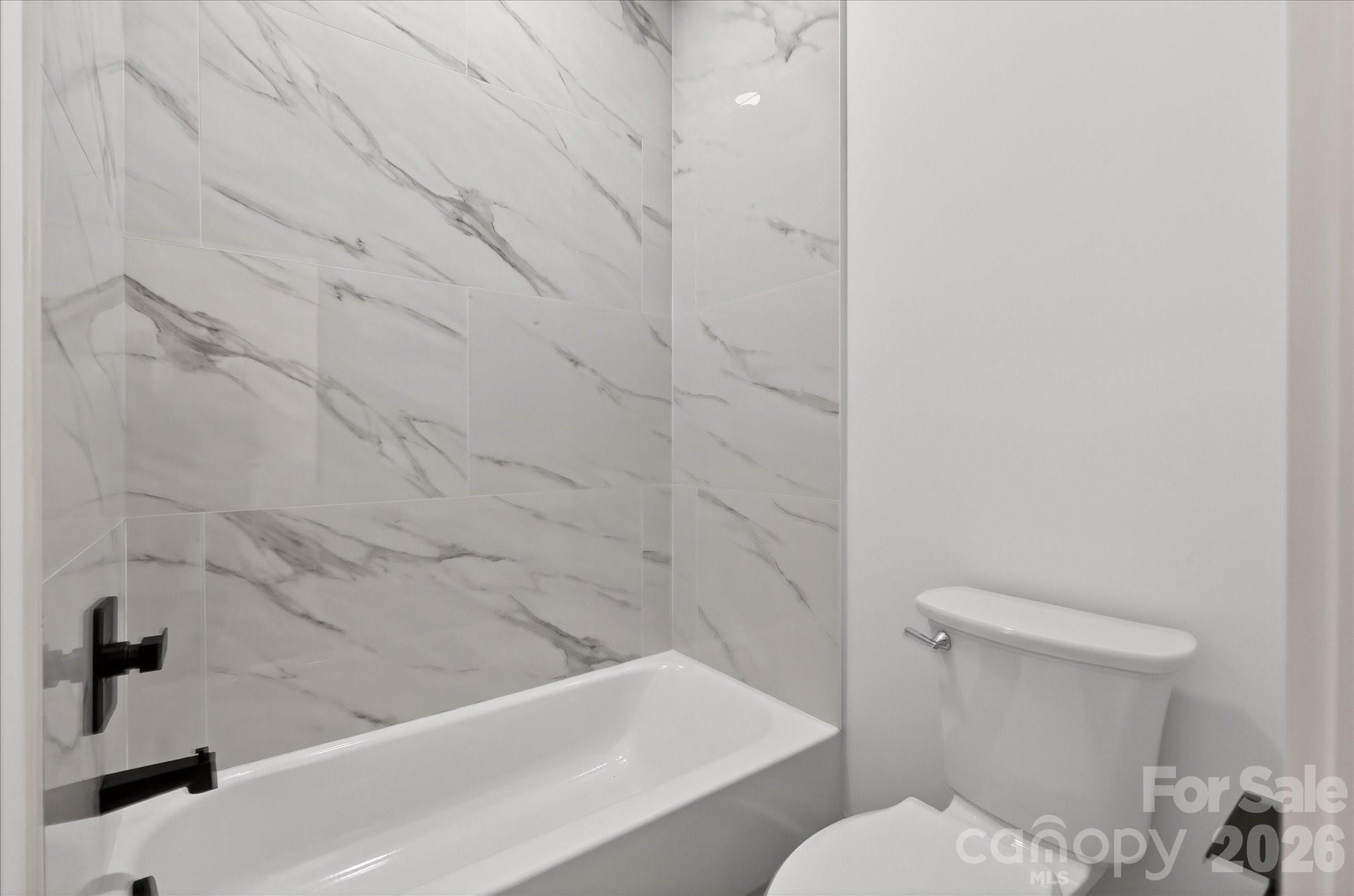 216 Lander Street Charlotte, NC 28208 - Photo 26 of 33 a bathroom with a sink and a toilet