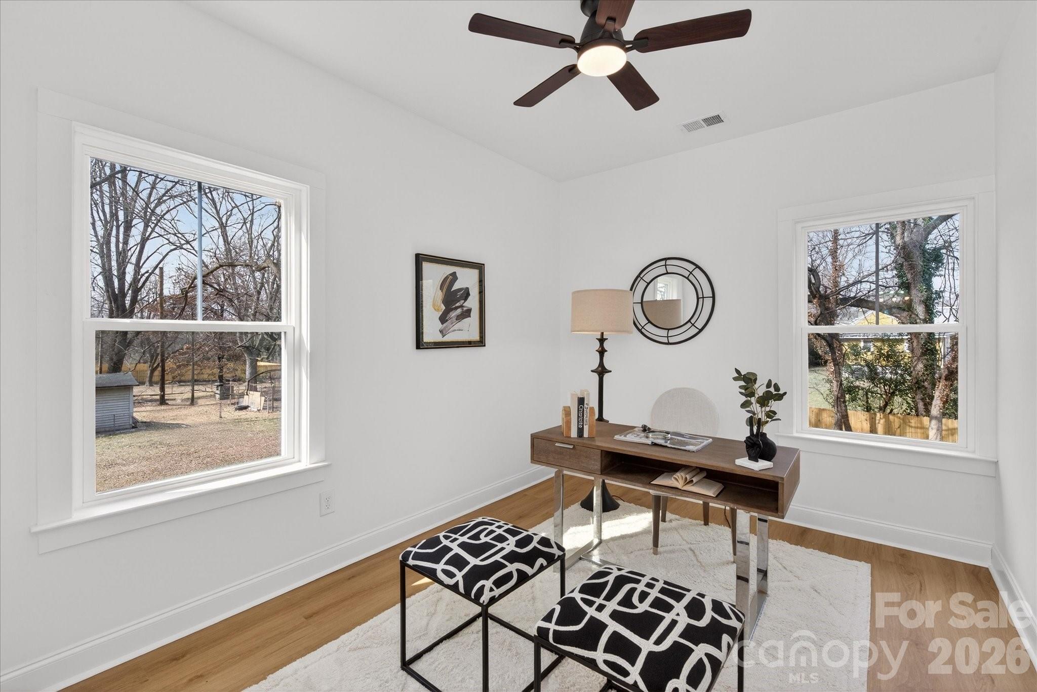 216 Lander Street Charlotte, NC 28208 - Photo 29 of 33 a workspace with wooden floor and a window
