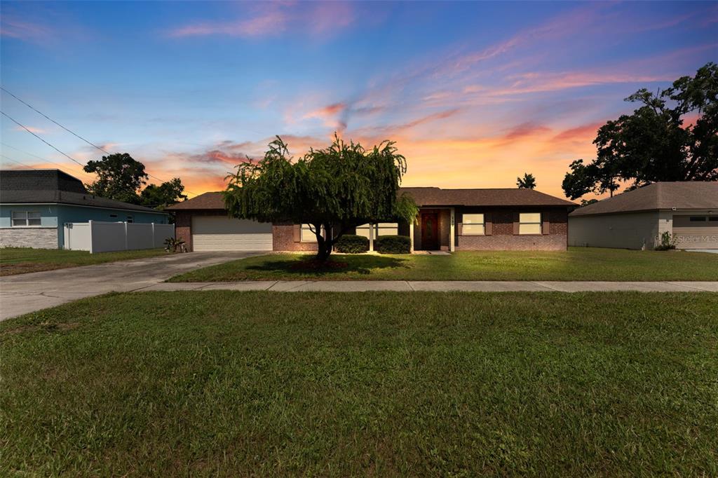 a view of a house with a big yard