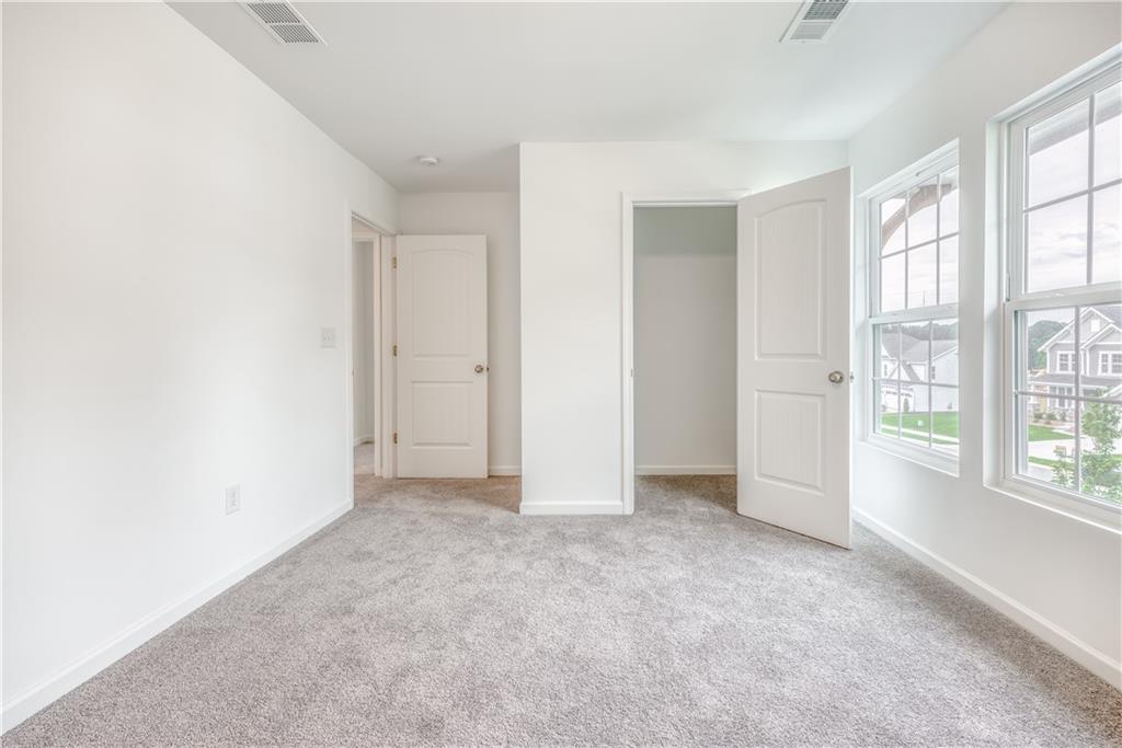 1377 R Liberty Park Drive Braselton, GA 30517 - Photo 19 of 38 an empty room with windows