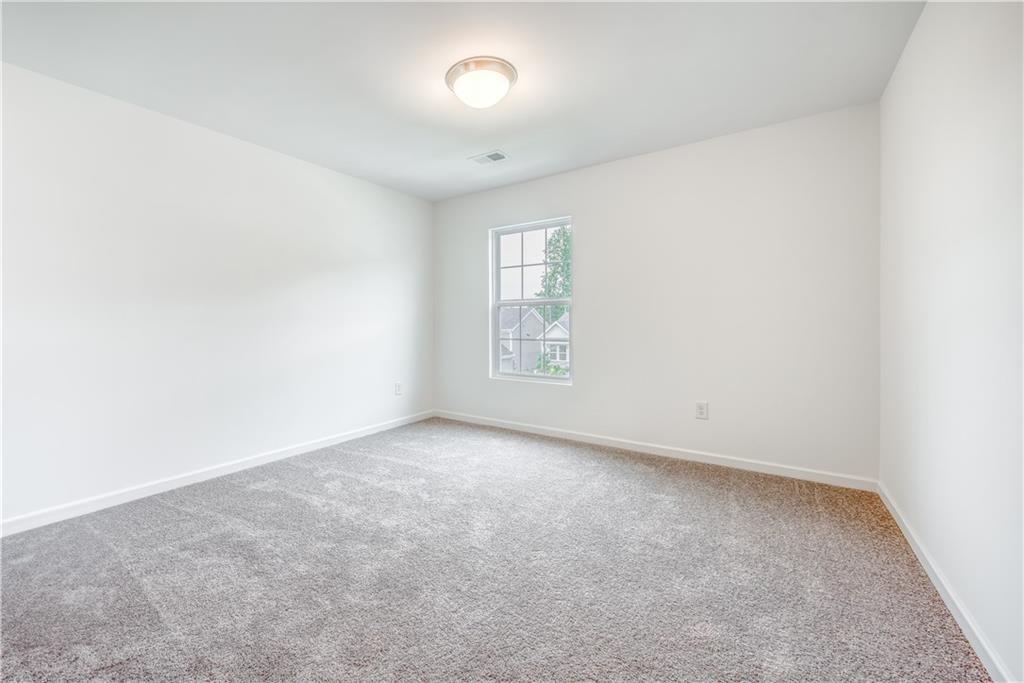 1377 R Liberty Park Drive Braselton, GA 30517 - Photo 20 of 38 an empty room with windows