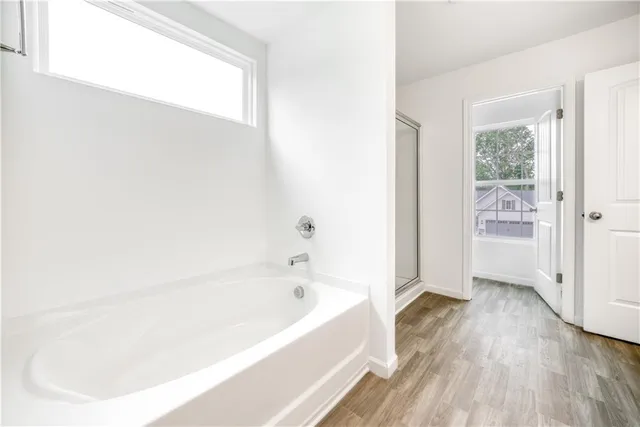 a spacious bathroom with a double vanity sink and mirror