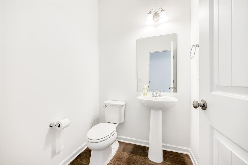 1377 R Liberty Park Drive Braselton, GA 30517 - Photo 26 of 38 a bathroom with a toilet sink and shower