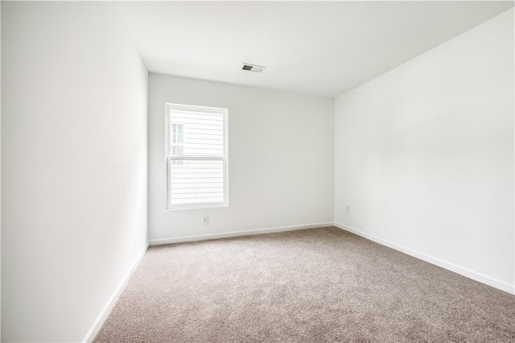 1377 R Liberty Park Drive Braselton, GA 30517 - Photo 29 of 38 a view of an empty room with a window