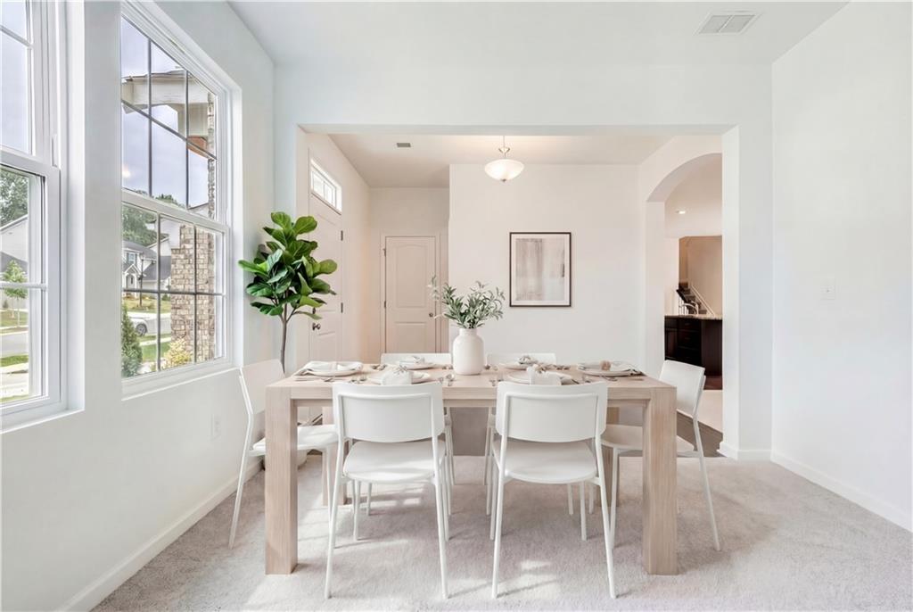 1377 R Liberty Park Drive Braselton, GA 30517 - Photo 3 of 38 a view of a dining room with furniture and window