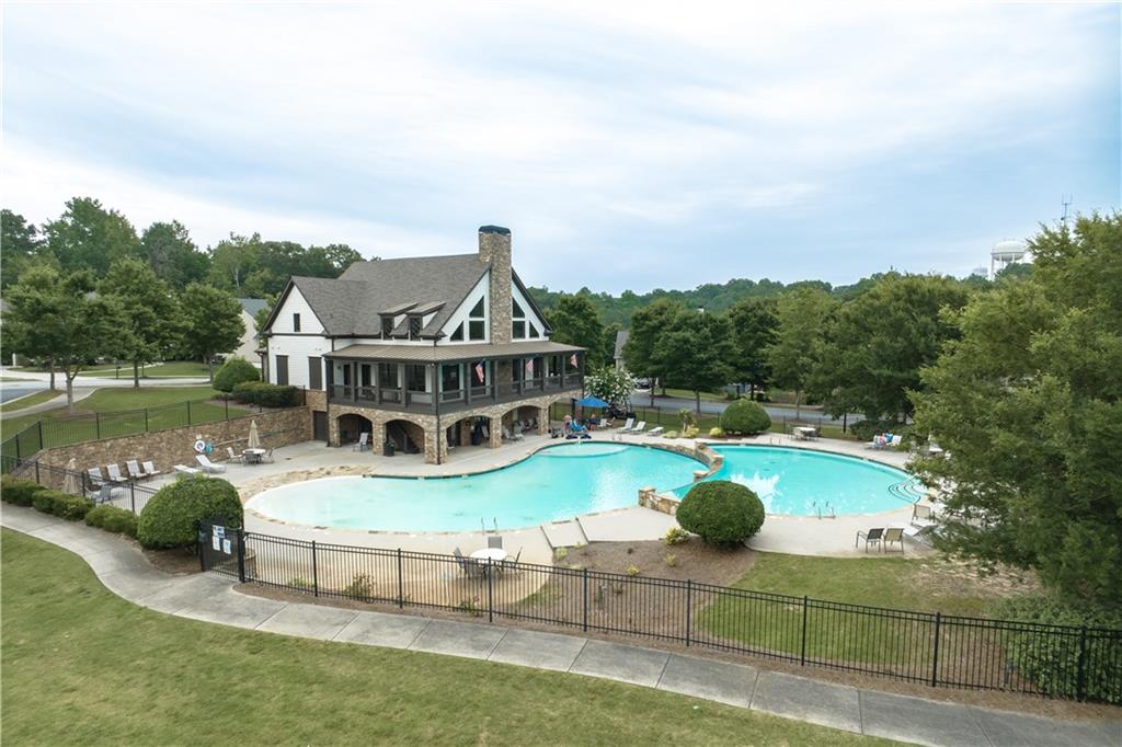 1377 R Liberty Park Drive Braselton, GA 30517 - Photo 31 of 38 a view of a house with pool and chairs