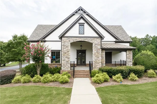 an aerial view of house with yard