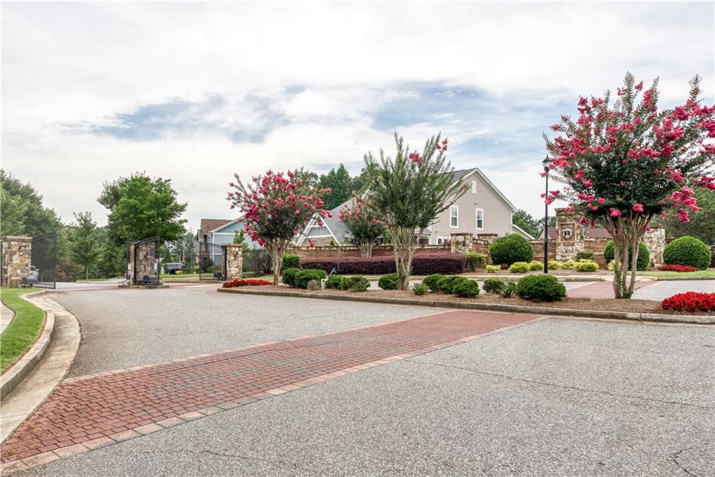 1377 R Liberty Park Drive Braselton, GA 30517 - Photo 36 of 38 a view of a street with a cars parked in front of it