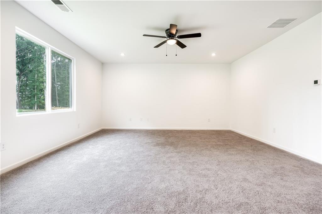 1377 R Liberty Park Drive Braselton, GA 30517 - Photo 6 of 38 an empty room with a window