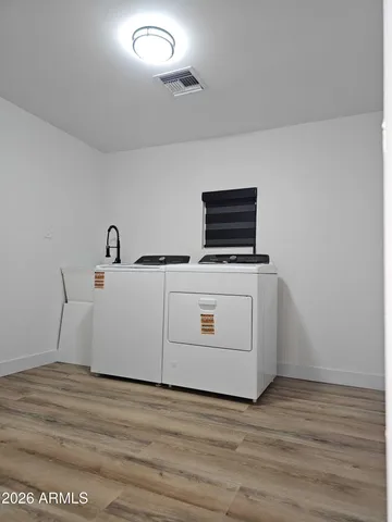 a utility room with washer and dryer