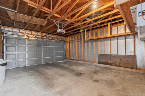a view of an empty room with a staircase