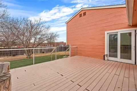 a view of backyard with small cabin
