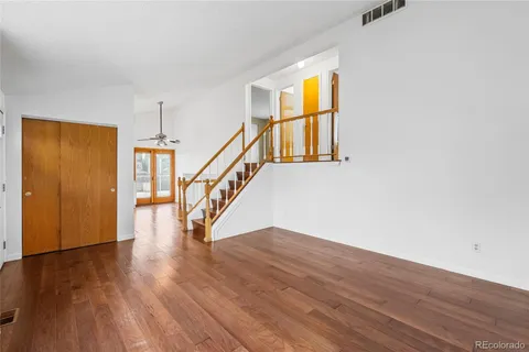 a view of entryway and hall with wooden floor