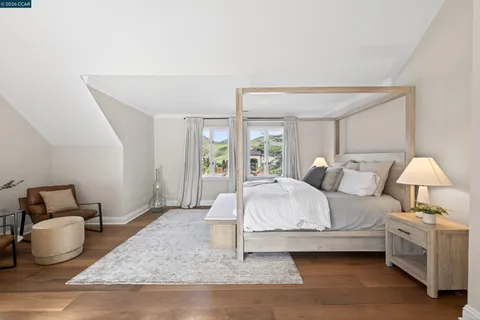 a bathroom with a double vanity sink mirror and toilet