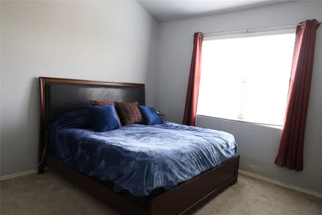 a bathroom with a shower and a sink