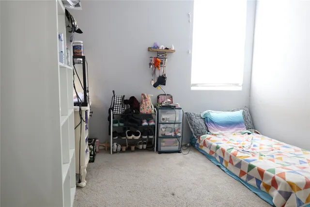 a view of a house with a small yard and floor to ceiling window