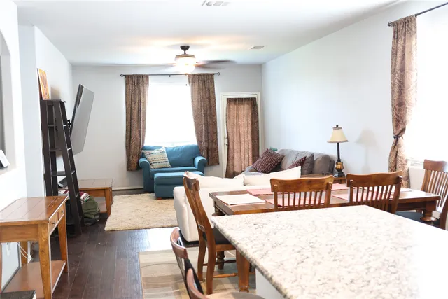 a bedroom with furniture and a window