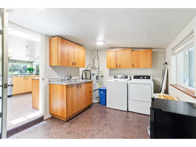 a kitchen with sink cabinets and window