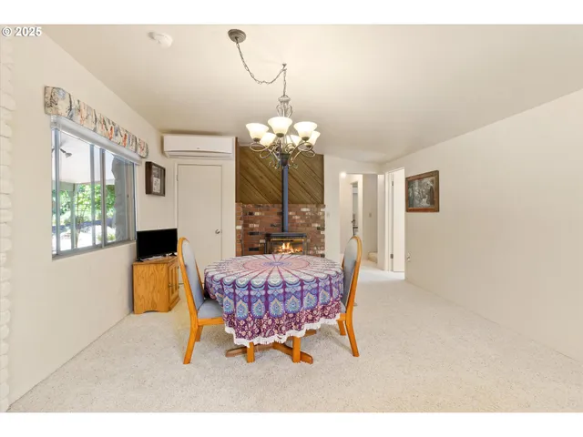 a dining room with furniture and window