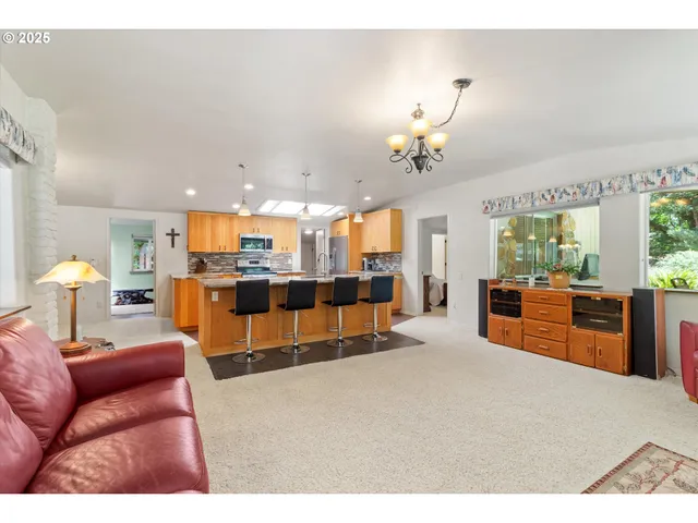 a bedroom with furniture and a chandelier