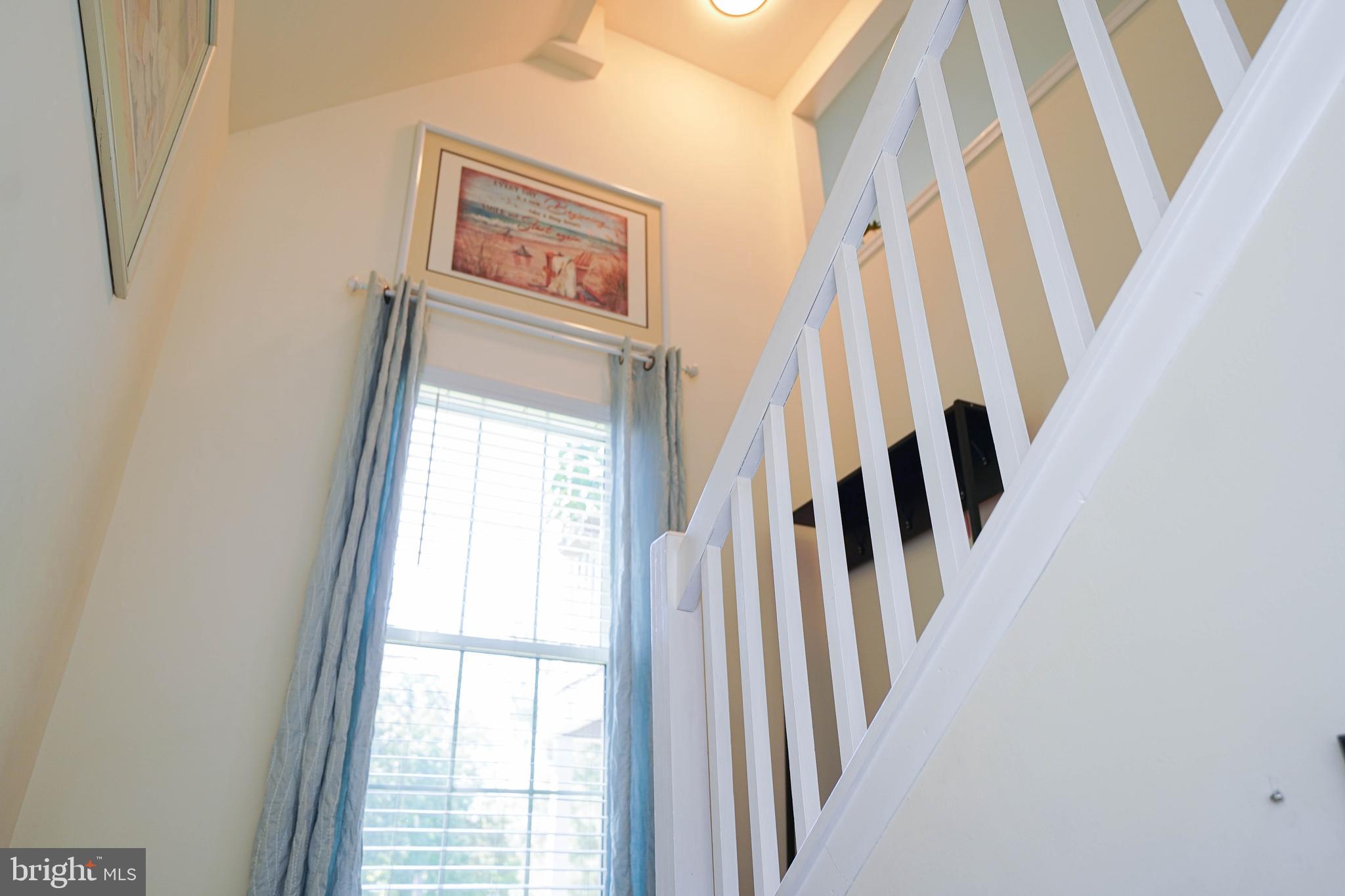 11421 Manklin Creek Road, Unit 4 Berlin, MD 21811 - Photo 5 of 47 Stairs leading from entry to 2nd level living