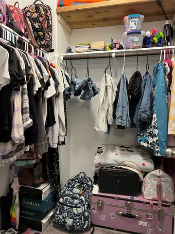 a room with lots of different colored cloths