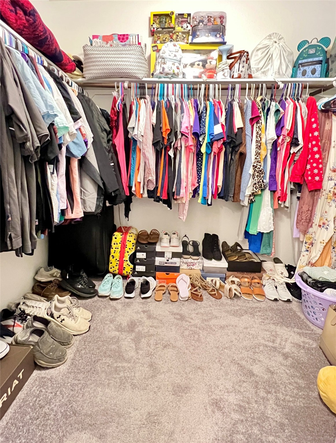14734 Jasper Stream Court Houston, TX 77069 - Photo 18 of 22 a view of walk in closet with clothes and shoes