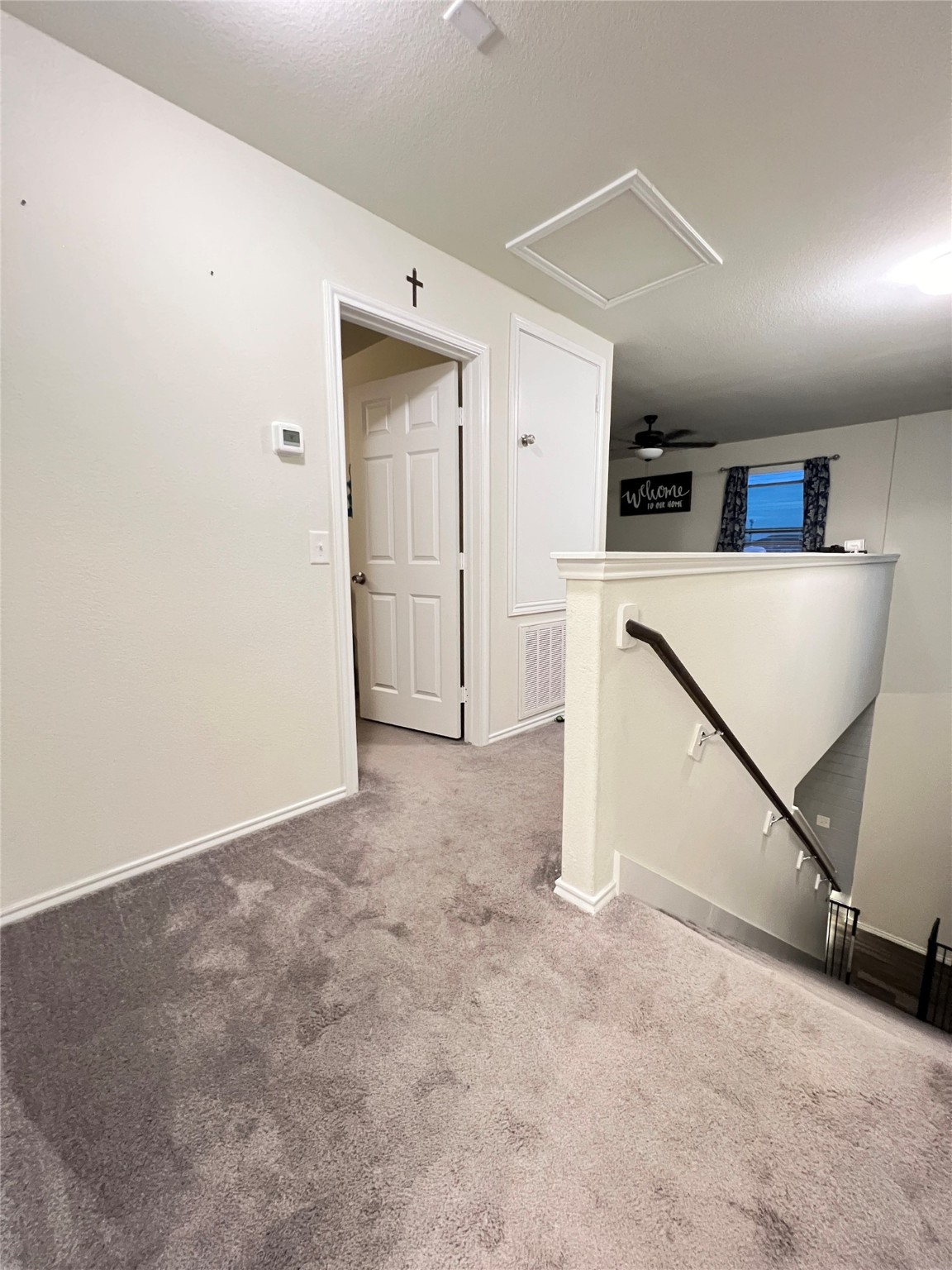 14734 Jasper Stream Court Houston, TX 77069 - Photo 10 of 22 a view of a kitchen with refrigerator and white cabinets