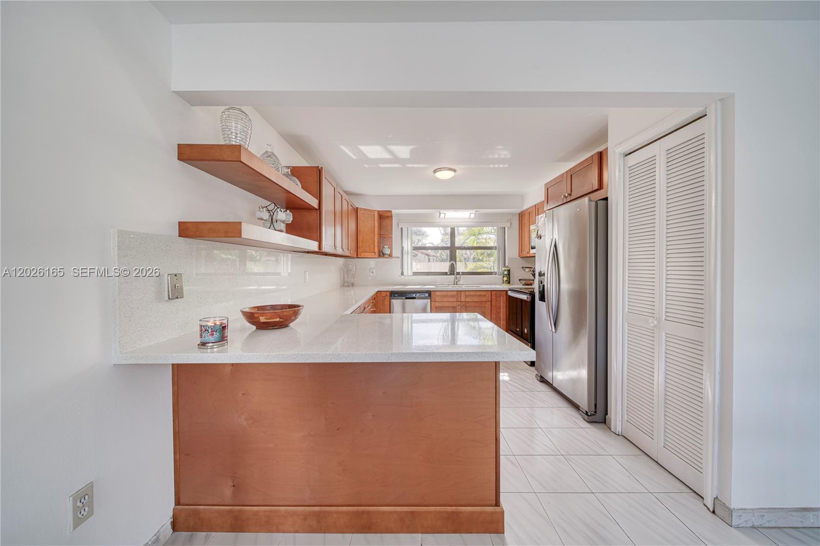 13337 Southwest 64th Lane Miami, FL 33183 - Photo 10 of 36 a kitchen with stainless steel appliances a refrigerator and a sink