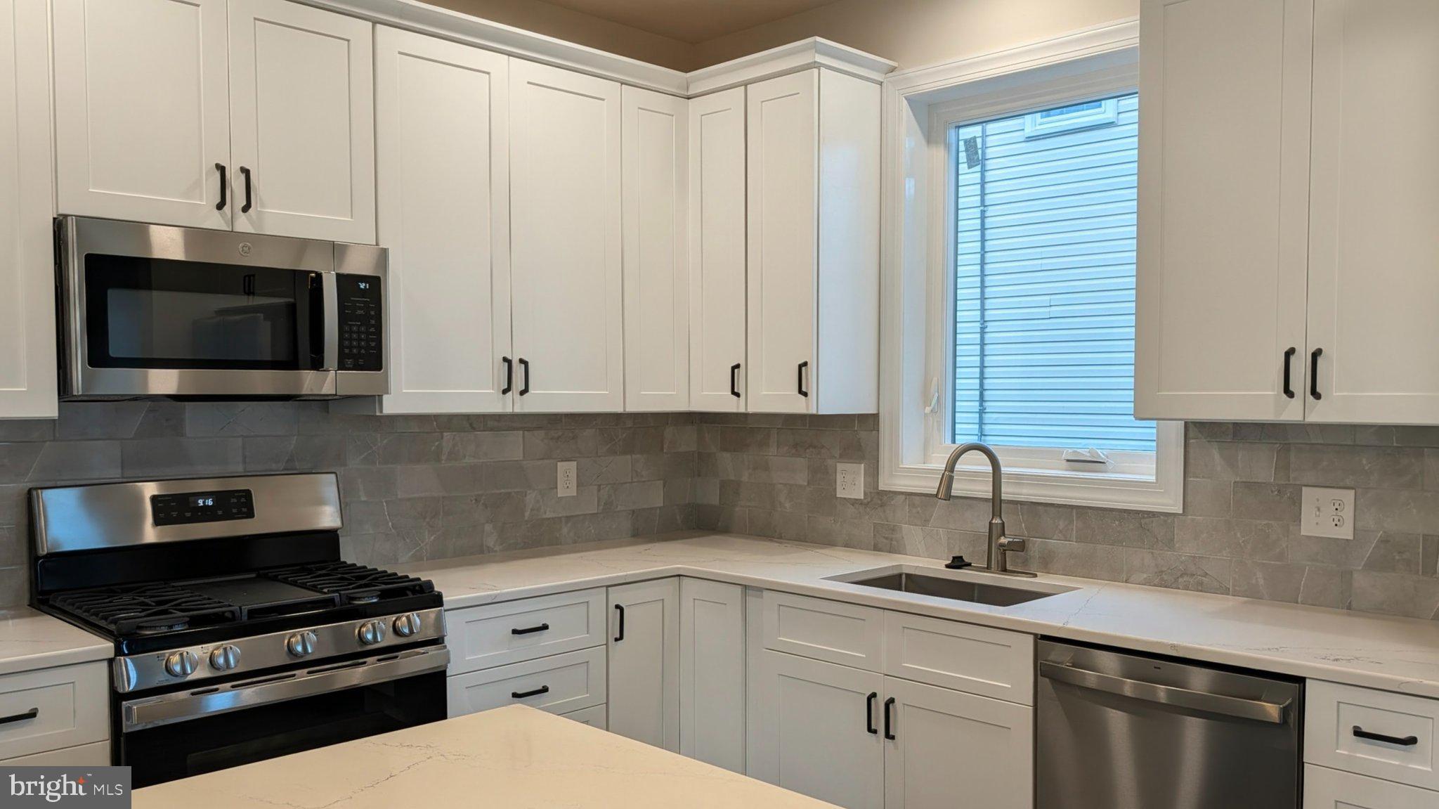 425 Rutledge Avenue Folsom, PA 19033 - Photo 13 of 33 Modern kitchen with sleek finishes.