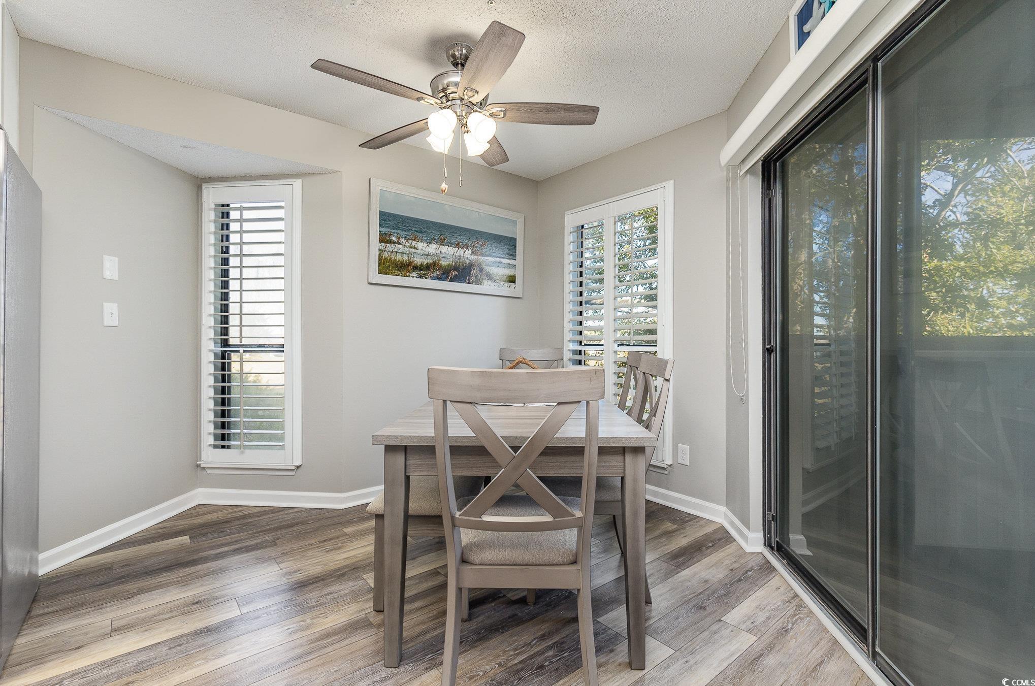 1101 Possum Trot Road, Unit B203 North Myrtle Beach, SC 29582 - Photo 14 of 37 Dining area featuring ceiling fan, hardwood / wood