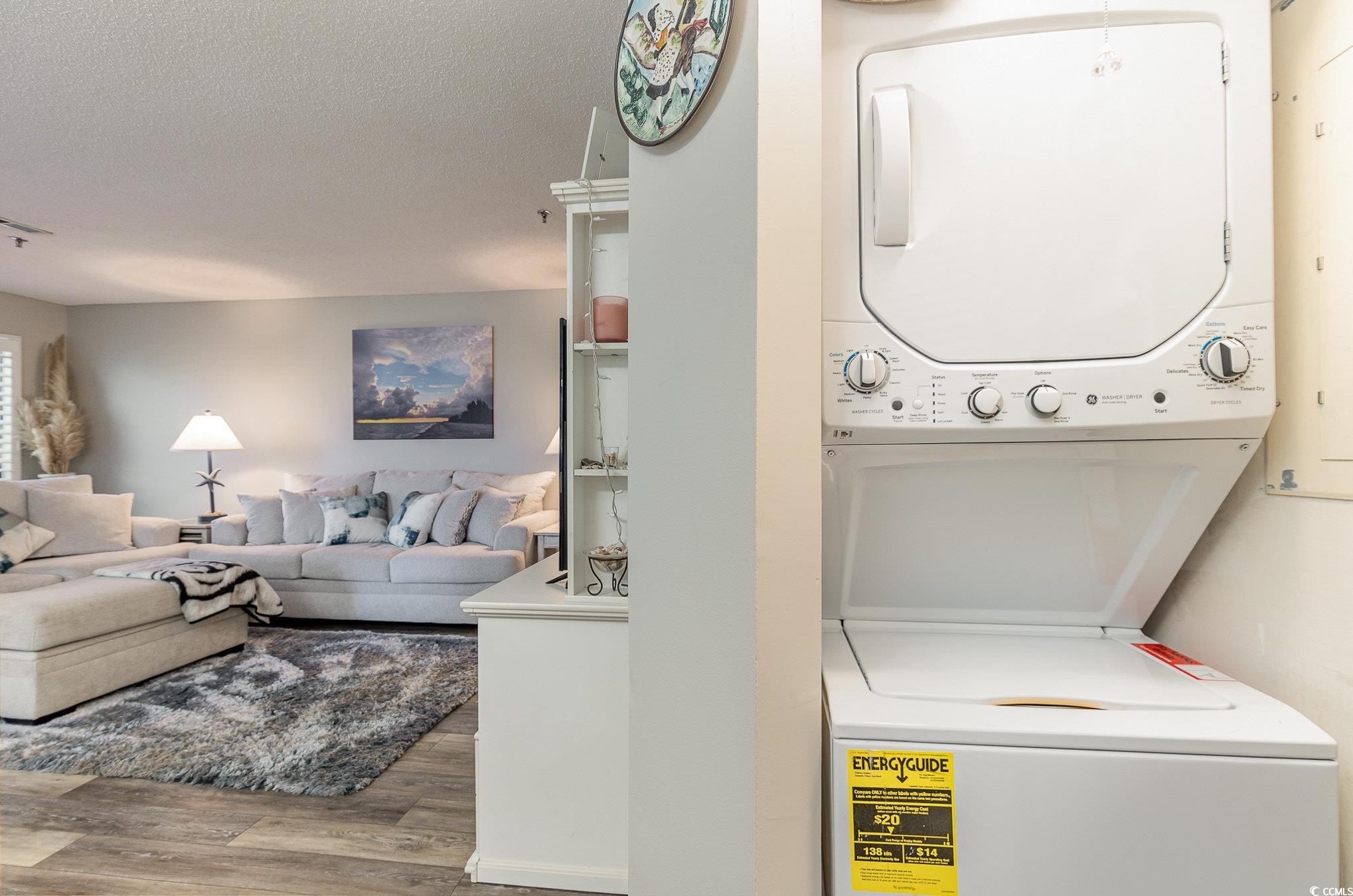 1101 Possum Trot Road, Unit B203 North Myrtle Beach, SC 29582 - Photo 15 of 37 Laundry room with hardwood / wood-style flooring,