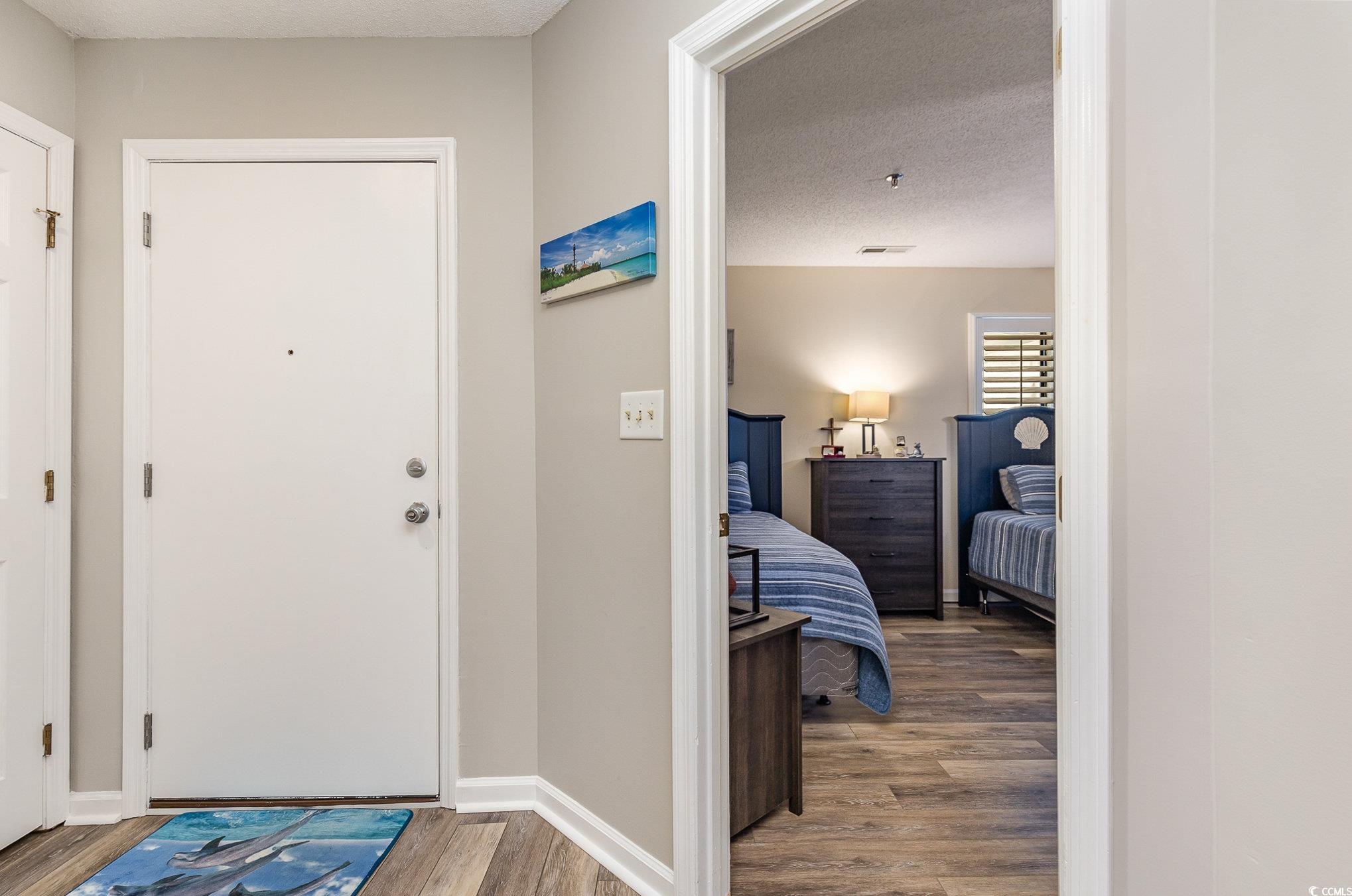 1101 Possum Trot Road, Unit B203 North Myrtle Beach, SC 29582 - Photo 21 of 37 Foyer entrance featuring wood-type flooring and a